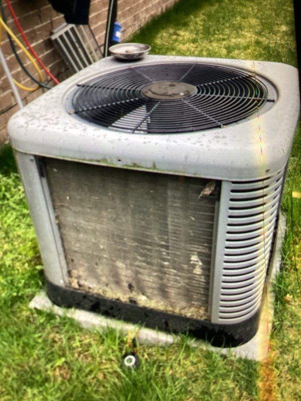 Completed annual cooling maintenance on residential outdoor condensing unit. Performed comprehensive system inspection, documenting equipment condition with unit showing typical weathering and dirt accumulation on cabinet surfaces and louvers. Verified proper operation of condenser fan and assessed overall system functionality during scheduled maintenance visit.