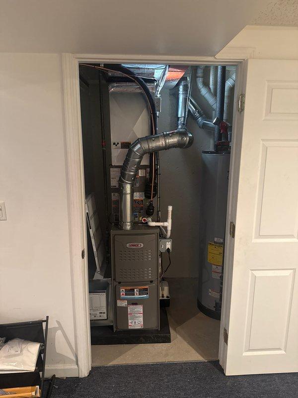 Completed full HVAC system installation including a 70,000 BTU Lennox furnace and 2-ton air conditioning unit with rear discharge configuration. Installed new ductwork with metallic rigid pipes and flexible ducting connections, along with PVC ventilation piping and inline ventilation components. All mechanical and electrical connections were completed, equipment was reconnected and tested for proper operation, and necessary permits were obtained for the installation.