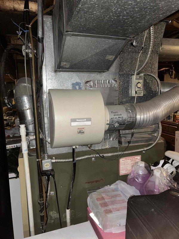 Provided estimate for complete HVAC system replacement in basement location. Existing 20+ year old furnace and air conditioning system non-operational, utilizing obsolete R-22 refrigerant. Assessment documented aging equipment showing significant deterioration including visible rust and corrosion on cabinet surfaces, indicating end of serviceable life and need for full system replacement rather than repair.