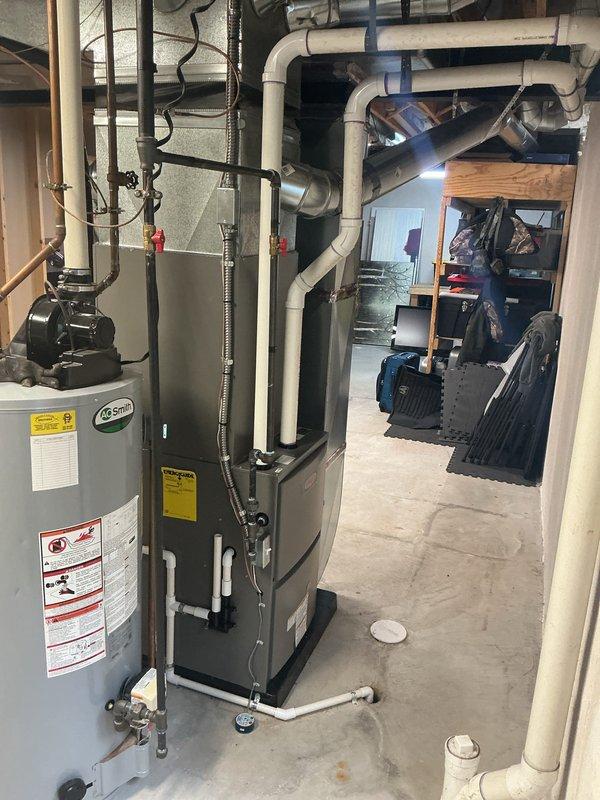 Successfully completed full HVAC system installation including a 90,000 BTU furnace and 3-ton air conditioning unit in left-side configuration. Obtained mechanical and electrical permits prior to installation, then performed complete system setup with all necessary venting through white PVC piping, ductwork connections, and electrical reconnections. All equipment installed to manufacturer specifications with proper clearances, humidifier integration, and complete testing to ensure optimal system performance.