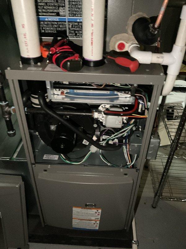 Performed comprehensive annual heating and cooling maintenance on residential HVAC system. Inspected furnace internal components including blower motor, heat exchanger, burner assembly, and control board with all components found in proper working condition. Verified electrical connections, tested safety controls, and examined venting system integrity. Evaluated outdoor condensing unit including compressor operation, fan motor function, and refrigerant pressures. Cleaned condenser coils, checked refrigerant lines for proper insulation, and confirmed electrical connections were secure. All system parameters tested within manufacturer specifications and unit operating efficiently for continued reliable performance.