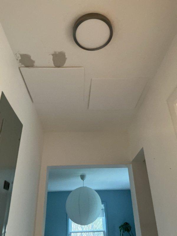 Responded to callback for ceiling repair following HVAC installation. Upon inspection, identified water staining on hallway ceiling near new equipment location, likely caused during installation process. Documented existing ceiling damage and floor surface conditions with photographic evidence for repair assessment and remediation planning.