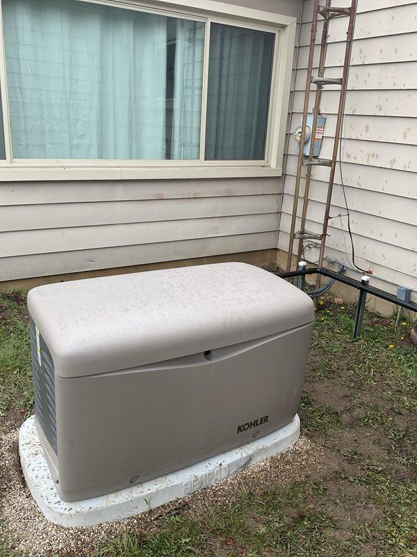 Completed full installation of Kohler residential standby generator system including exterior generator unit mounted on concrete pad, interior Kohler transfer switch panel, and essential circuits panel in basement utility area. Coordinated and obtained all required permits for mechanical, electrical, generator, gas piping, pressure testing, and transfer switch components. Successfully integrated generator system with existing electrical service, completed all necessary wiring connections through basement ceiling joists, and verified proper operation of transfer switch with indicator lights functioning correctly.