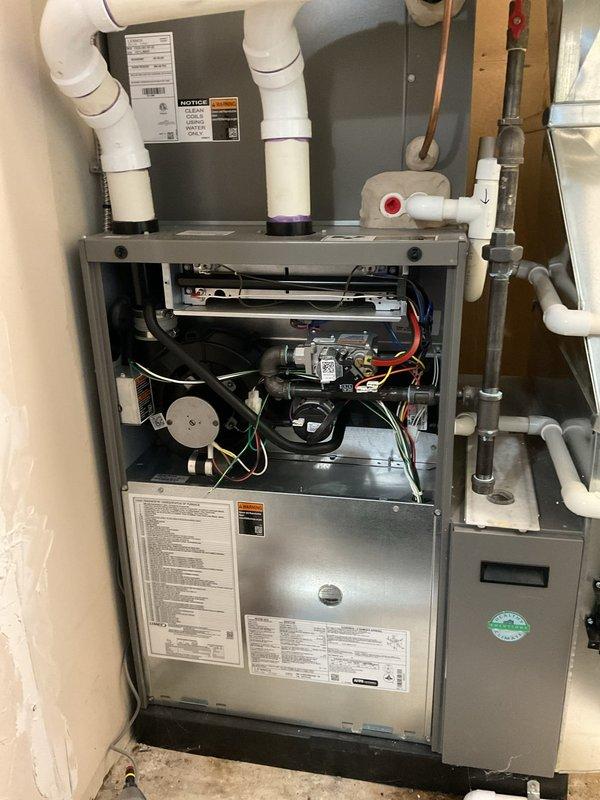 Completed comprehensive ComfortGuard maintenance package on residential split HVAC system, including full inspection of gas furnace with blower assembly and outdoor condensing unit. Performed standard preventive maintenance procedures, verified proper operation of all mechanical and electrical components, and documented system condition with access panel removed for thorough internal assessment.