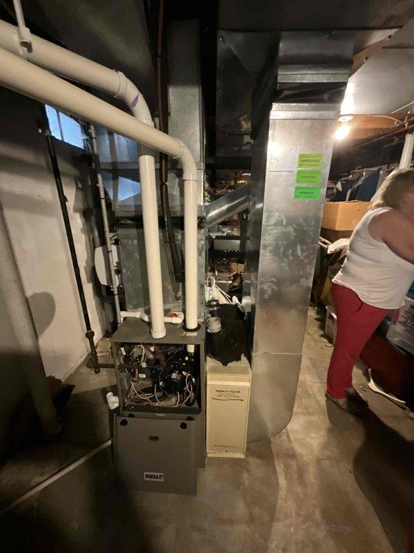 Responded to service call for intermittent furnace and air conditioner operation following multiple failed repair attempts. Conducted comprehensive evaluation of existing Wolf furnace and air conditioning system in residential basement mechanical room. Documented current equipment condition through photographs, noting aging infrastructure including corroded metal piping, older ductwork with moisture accumulation, and mixed plumbing components combining newer PVC with deteriorated metal connections. Assessed heating unit access panel, internal wiring, venting configuration, and air handler assembly to determine system viability. Prepared replacement estimate for complete HVAC system due to repeated equipment failures and end-of-service-life conditions. Provided paper documentation as requested and coordinated communication protocols for property access.