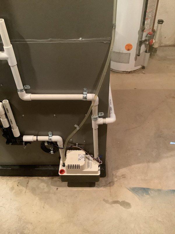 Responded to service call for GFCI tripping issue on 2024 furnace system located in basement. Upon inspection, found evaporator coil heavily contaminated with dust and debris accumulation, which was likely causing electrical load fluctuations and moisture-related issues leading to GFCI trips. Documented existing condition of HVAC equipment including air handler assembly and condensate pump system with white PVC drainage piping. Advised customer of necessary cleaning and maintenance requirements to prevent future electrical interruptions and ensure proper system operation.