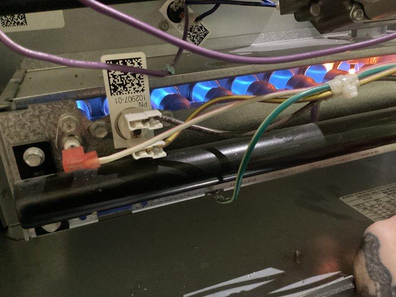 Completed annual furnace maintenance and tune-up on residential heating system. Performed comprehensive inspection of all internal components including blower motor assembly, gas burners, electrical connections, and control systems. Verified proper ignition sequence with burners displaying optimal blue flame pattern. Inspected all wiring connections, safety switches, and circuit boards for secure operation. All components found to be in excellent working condition with system operating within manufacturer specifications. Unit photographed and documented for service records.