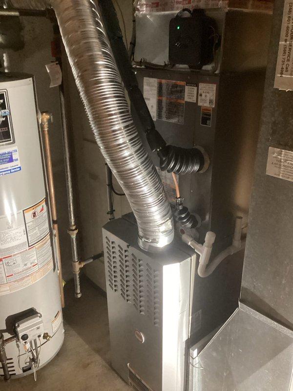 Completed installation of 3-ton air conditioning system with matching evaporator coil at residential property. Installed outdoor condensing unit at rear of home with proper clearances from foundation and landscaping, connected refrigerant lines, and mounted indoor evaporator coil to existing furnace in basement mechanical room. Established electrical connections, performed system startup, verified proper refrigerant charge and airflow, and confirmed all components operating within manufacturer specifications. All required mechanical, electrical, and air conditioning permits obtained and work completed in compliance with local code requirements.