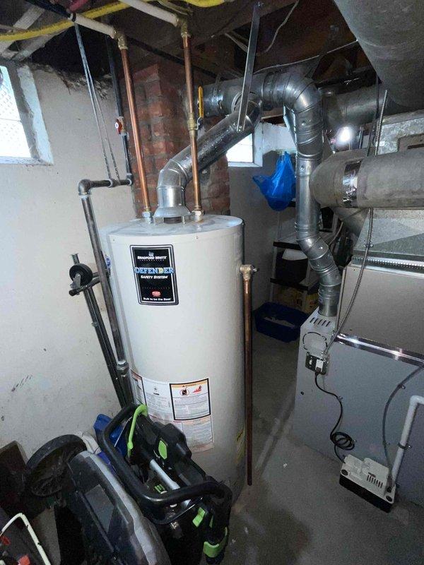 Conducted comprehensive assessment of existing 16-year-old air conditioning system that has been non-functional since property purchase in 2022, with unit circulating air but failing to provide cooling. Inspected basement mechanical room housing recently replaced furnace, water heater, and extensive ductwork network with copper piping connections. Evaluated attic-level ductwork system showing age-related deterioration and identified disconnected flexible ducting requiring reconnection. Provided full system replacement estimate for air conditioning unit to address cooling failure and restore proper HVAC functionality.