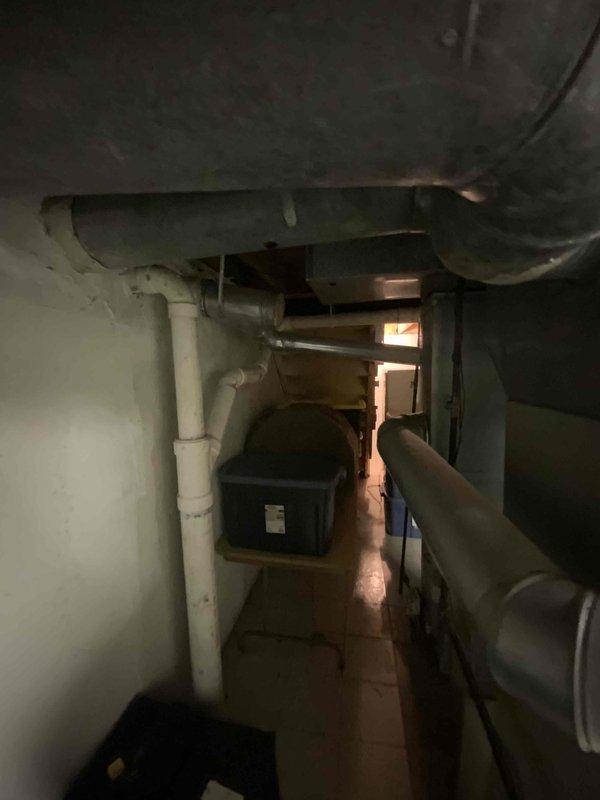 Conducted estimate for air conditioning system replacement. Existing unit is 21 years old, completely flat on refrigerant, and beyond economical repair. Inspected basement utility area housing furnace, ductwork, and associated HVAC infrastructure to assess compatibility and requirements for new AC installation. Customer seeking immediate replacement due to system failure and age of equipment.