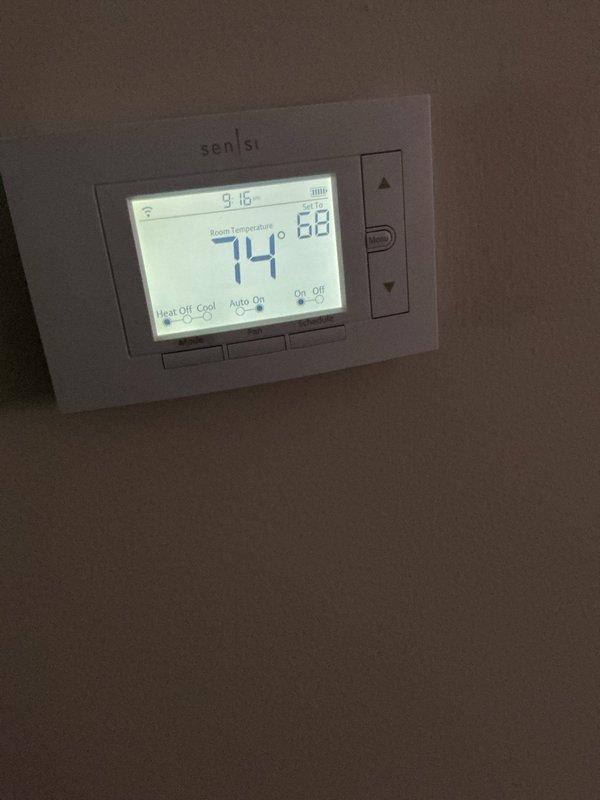 Performed annual cooling maintenance on Lennox HVAC system. Inspected furnace unit, verified proper operation of Sensi thermostat displaying 74°F current temperature with 68°F setpoint, checked all mechanical components, ductwork, and PVC condensate drain lines for proper function and clearance.