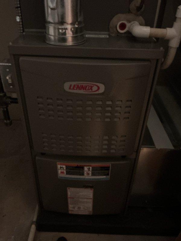 Performed annual cooling maintenance on Lennox HVAC system. Inspected furnace unit, verified proper operation of Sensi thermostat displaying 74°F current temperature with 68°F setpoint, checked all mechanical components, ductwork, and PVC condensate drain lines for proper function and clearance.