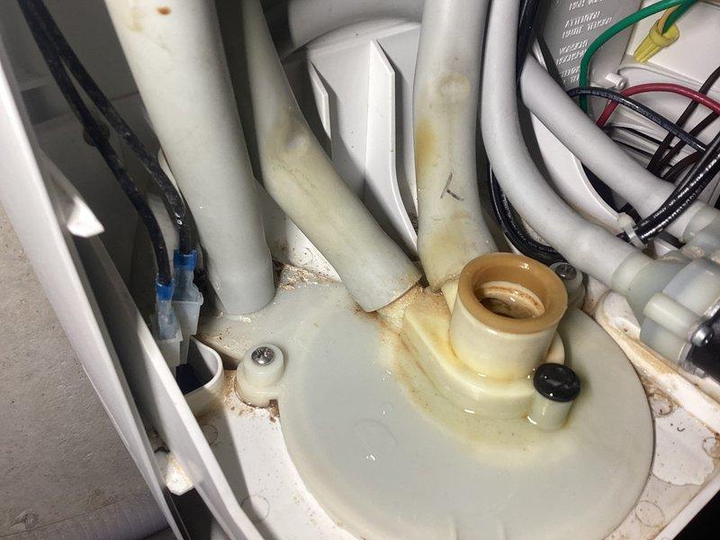 Responded to service call for leaking humidifier canister that was recently installed. Upon inspection, found extensive rust staining and water damage on the mounting platform and surrounding components, confirming active leak from the canister assembly. Replaced defective humidifier canister (part #35-15) and verified proper seal and operation of the system with no further leakage detected.