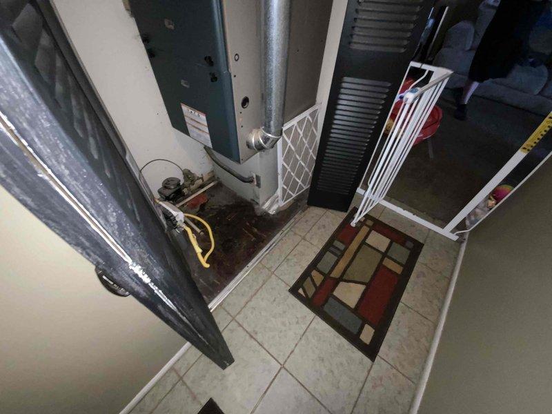 Conducted comprehensive assessment of existing HVAC system located in main floor utility closet for complete furnace and air conditioning replacement estimate. Evaluated current natural gas furnace and A/C equipment, documented existing installation configuration including ductwork connections, electrical service requirements, and spatial constraints within the utility area. Provided detailed replacement quote with equipment specifications and installation requirements for new heating and cooling system.