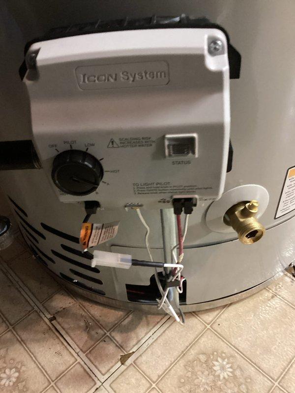 Completed installation of 50-gallon tanked water heater with ICON System control unit. Reconnected all water supply lines, configured B-vent exhaust system, and established proper gas connections. Unit was tested for proper operation, temperature controls calibrated, and all safety features verified functional.