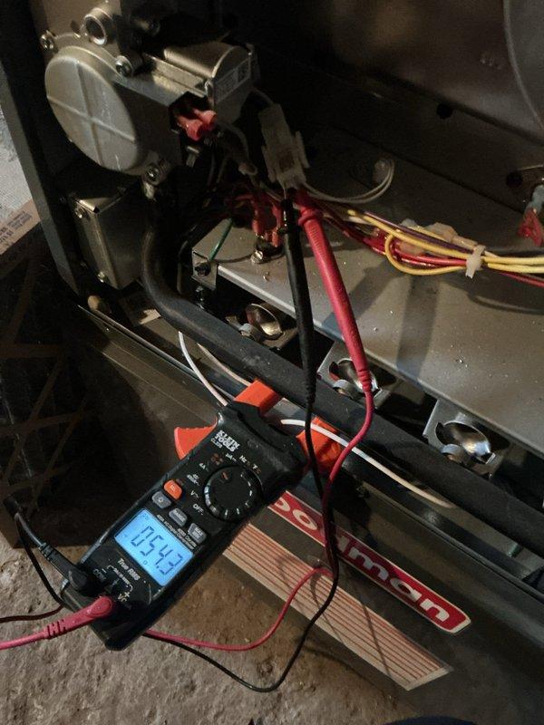 Completed comprehensive HVAC maintenance inspection including both heating and cooling systems. Performed electrical diagnostics with multimeter, verifying proper voltage readings at 5.49V on control circuits, and inspected internal components including blower assembly, wiring connections, and control boards. Confirmed thermostat operation showing 77°F with system in OFF mode and all programming functions working correctly.