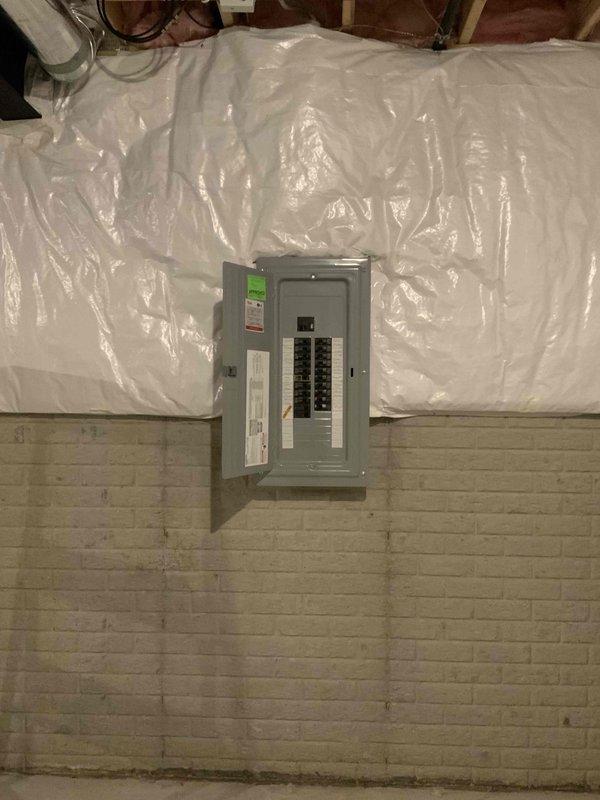 Conducted on-site evaluation for ductless mini split system installation in detached garage space. Assessed electrical panel capacity and existing circuit breaker configuration to determine power requirements for new mini split unit. Documented installation location, evaluated wall mounting options on painted brick surfaces, and verified adequate clearances for both indoor and outdoor unit placement. Provided comprehensive estimate for complete system installation including electrical connections from existing panel.