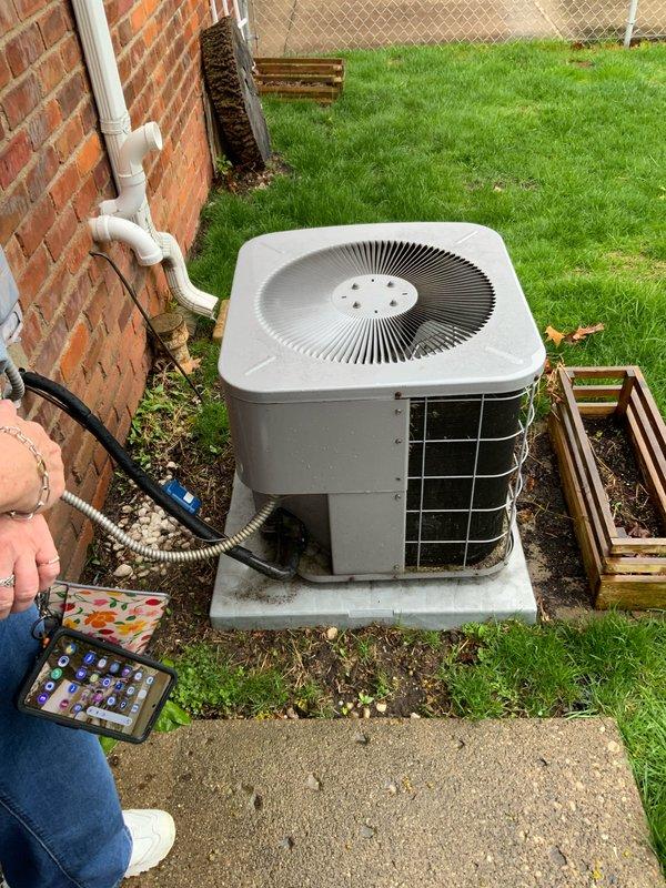 Conducted on-site evaluation for complete air conditioning system replacement at residential property. Assessed existing outdoor condenser unit positioned on concrete pad adjacent to brick exterior, noting refrigerant lines and electrical connections. Inspected indoor Carrier furnace system and associated ductwork in basement mechanical room to ensure compatibility with proposed AC replacement. Documented current system configuration including PVC condensate drainage, refrigerant line routing, and electrical service. Provided comprehensive replacement estimate for new air conditioning system with priority scheduling for earliest available installation.