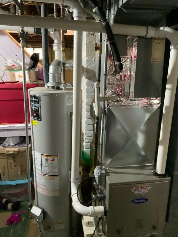 Conducted on-site evaluation for complete air conditioning system replacement at residential property. Assessed existing outdoor condenser unit positioned on concrete pad adjacent to brick exterior, noting refrigerant lines and electrical connections. Inspected indoor Carrier furnace system and associated ductwork in basement mechanical room to ensure compatibility with proposed AC replacement. Documented current system configuration including PVC condensate drainage, refrigerant line routing, and electrical service. Provided comprehensive replacement estimate for new air conditioning system with priority scheduling for earliest available installation.