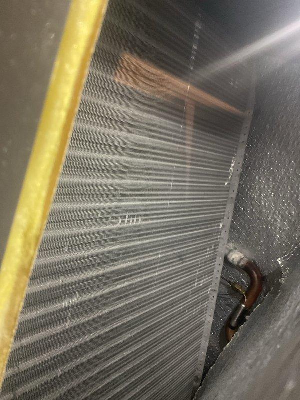 Completed comprehensive AC/coil maintenance as part of recurring ComfortGuard preventive maintenance program. Performed thorough inspection of evaporator coil assembly, verified proper heat exchange fin condition, and checked refrigerant line connections for integrity. Temperature measurements confirmed system operating within normal parameters, and all components showed appropriate functionality with no deficiencies noted.