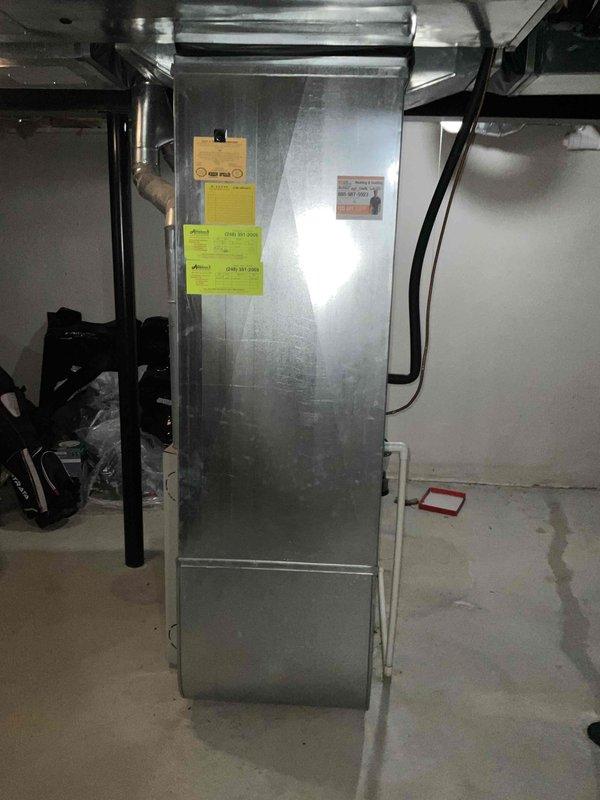 Conducted on-site evaluation for complete HVAC system replacement, assessing existing air conditioning condenser unit mounted on exterior concrete pad and indoor air handler located in basement mechanical room. Documented current equipment conditions, utility connections, and installation specifications to provide comprehensive quote for new furnace and air conditioning system installation.