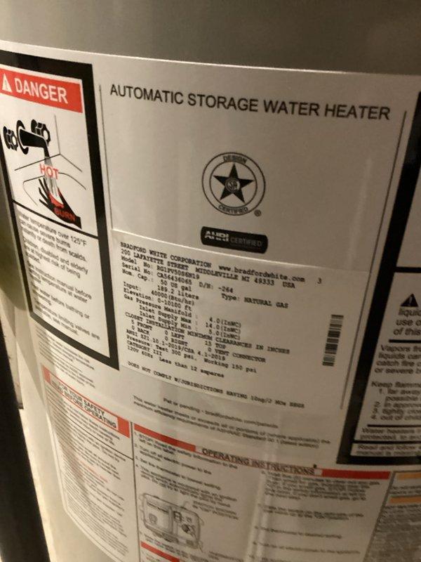 Successfully completed warranty installation of Bradford White automatic storage water heater with all necessary plumbing connections and safety components. Installed thermal expansion tank to protect system from excessive pressure buildup and ensure code compliance. All copper supply lines, brass valve fittings, and control components properly connected and tested for proper operation, with unit mounted securely on concrete pad and all manufacturer specifications verified.