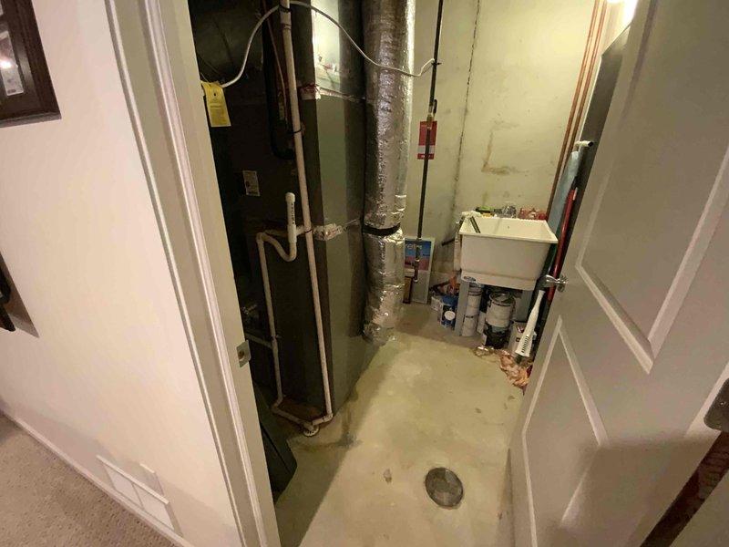 Provided comprehensive estimate for full HVAC system replacement in mid-large residential property (2000-3000 sq.ft.) with basement installation. Assessed existing heating and cooling infrastructure including air handler unit, ductwork configuration, and natural gas/propane compatibility for combined heating and cooling system. Documented current equipment layout, utility room dimensions, and existing duct routing to develop specifications for new system installation.