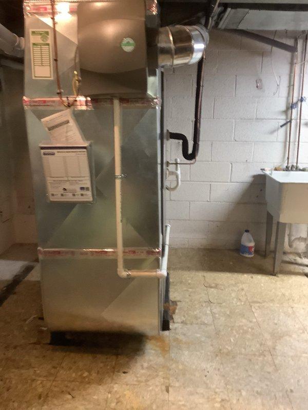 Replaced defective heat exchanger and PCO kit on residential furnace system under warranty coverage. Unit is a Lennox model located in basement utility area with standard PVC condensate drainage configuration. Both components were sourced from Lennox supply house and installed per manufacturer specifications to restore proper heating system operation.