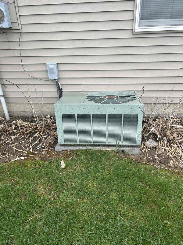Completed full HVAC system installation for a medium-sized residential property (1200-2000 sq.ft.) including natural gas furnace with air conditioning. Indoor equipment installed in closet utility space features new furnace unit with TRION Max 5 air filtration system, configured ductwork with proper connections and routing, and all necessary electrical wiring. Outdoor condensing unit installed on concrete pad against exterior wall with appropriate electrical disconnect, refrigerant line connections, and conduit runs through siding. System tested and operational for both heating and cooling functions.