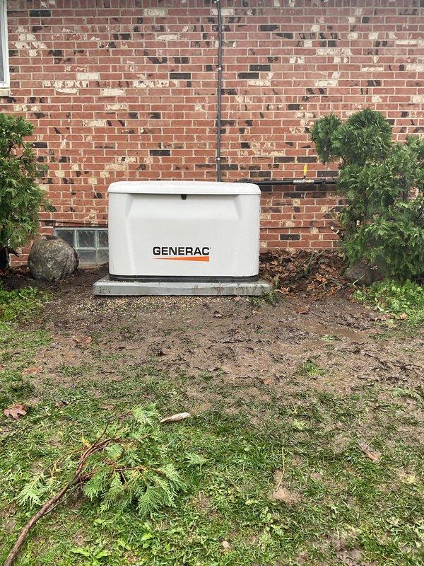 Installed 18kW Generac residential backup generator on level concrete pad against exterior brick wall with proper clearances. Mounted 200-amp automatic transfer switch to exterior wall with weatherproof enclosure, completed all electrical connections including service entrance conductors, grounding system with copper ground loops, and proper bonding to main electrical panel. Ran electrical conduit from transfer switch to generator unit, secured all wiring per NEC requirements with appropriate cable management and strain relief. Connected natural gas supply line to generator with pressure testing to verify system integrity and leak-free operation. Verified proper operation of automatic transfer switch functionality and generator startup sequence. All work performed under proper electrical and mechanical permits, installation meets manufacturer specifications and local code requirements.