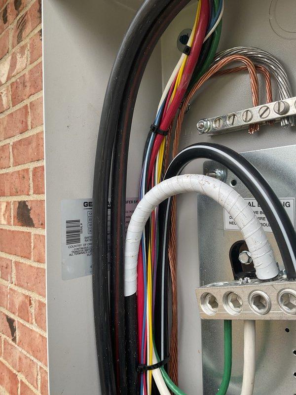 Installed 18kW Generac residential backup generator on level concrete pad against exterior brick wall with proper clearances. Mounted 200-amp automatic transfer switch to exterior wall with weatherproof enclosure, completed all electrical connections including service entrance conductors, grounding system with copper ground loops, and proper bonding to main electrical panel. Ran electrical conduit from transfer switch to generator unit, secured all wiring per NEC requirements with appropriate cable management and strain relief. Connected natural gas supply line to generator with pressure testing to verify system integrity and leak-free operation. Verified proper operation of automatic transfer switch functionality and generator startup sequence. All work performed under proper electrical and mechanical permits, installation meets manufacturer specifications and local code requirements.