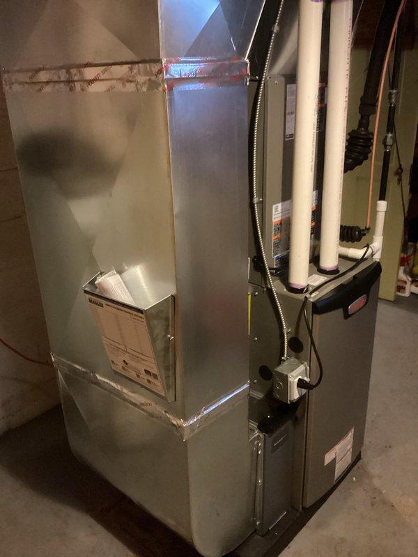 Completed full HVAC system installation including 70,000 BTU gas furnace, 2.5-ton air conditioning unit with rear discharge configuration, and water heater replacement in basement utility area. Installed new ductwork connections with proper sealing, ran PVC condensate drainage and venting lines, connected flexible gas line to water heater, established copper water supply lines, and completed all electrical connections including disconnect box. Secured all necessary permits for mechanical and electrical work, ensured proper venting for both furnace and water heater, and reconnected all systems to operational status per manufacturer specifications.