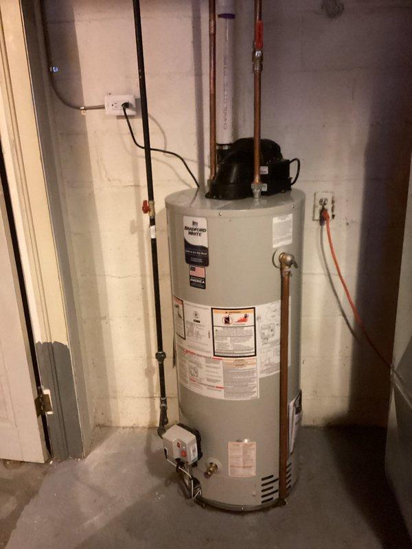 Completed full HVAC system installation including 70,000 BTU gas furnace, 2.5-ton air conditioning unit with rear discharge configuration, and water heater replacement in basement utility area. Installed new ductwork connections with proper sealing, ran PVC condensate drainage and venting lines, connected flexible gas line to water heater, established copper water supply lines, and completed all electrical connections including disconnect box. Secured all necessary permits for mechanical and electrical work, ensured proper venting for both furnace and water heater, and reconnected all systems to operational status per manufacturer specifications.