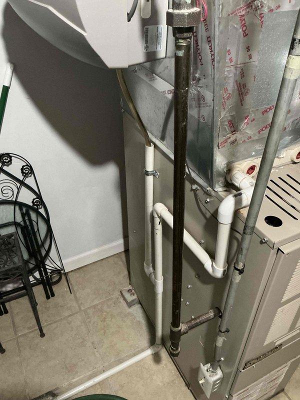 Conducted comprehensive assessment of existing HVAC system for replacement estimate. Evaluated 18-year-old furnace and 16-year-old air conditioning unit showing significant age-related deterioration. Documented current equipment condition including corroded ductwork, aged insulation wrapping, and weathered mechanical components in basement utility area. Photographed furnace with connected PVC condensate drainage lines, copper piping, and deteriorated reflective duct insulation. Assessed AC system components and overall infrastructure to provide accurate replacement recommendations. Prepared detailed estimate for complete HVAC system replacement to address equipment exceeding expected service life.