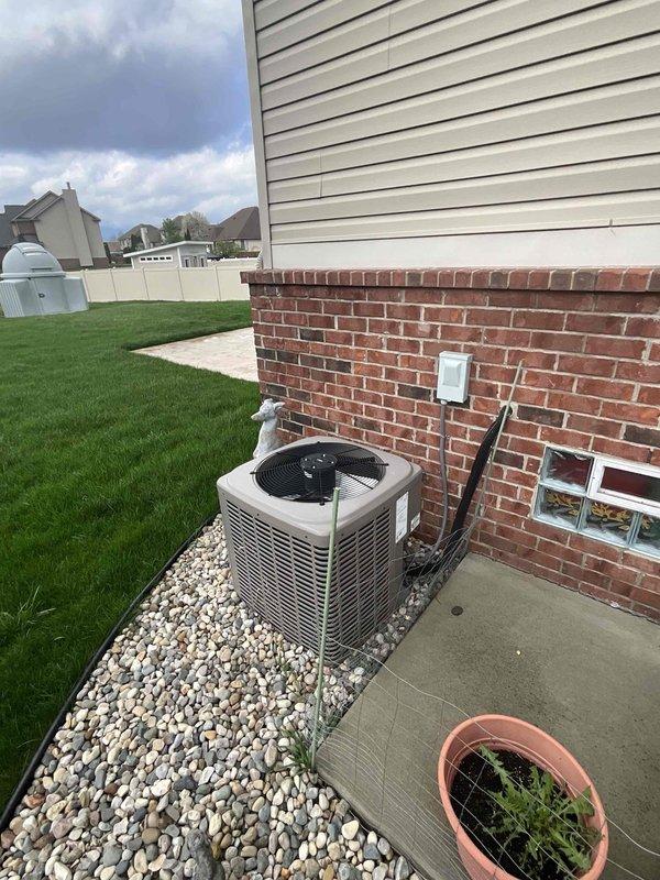 Conducted comprehensive assessment of existing 15-year-old HVAC system for full replacement estimate in colonial-style residence with forced air heating and cooling. Evaluated York natural gas furnace located in basement mechanical room and exterior air conditioning unit positioned on decorative stone bed against brick foundation. System assessment included examination of existing ductwork configuration, PVC venting infrastructure, electrical connections, and overall equipment condition to determine specifications for complete furnace and air conditioning replacement. Documented current equipment placement, utility connections, and installation parameters to provide accurate pricing for new system installation.