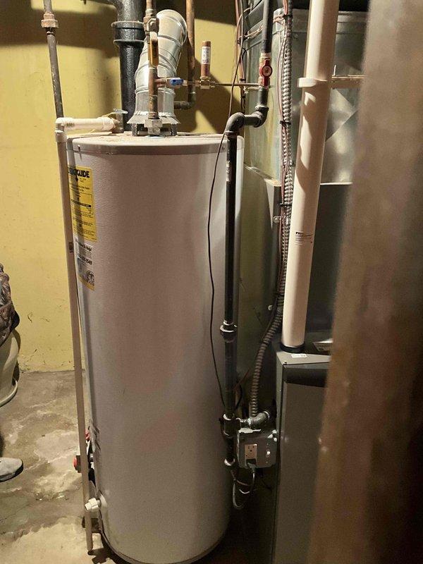 Provided comprehensive estimate for water heater replacement options including both tankless and standard tank configurations for residential property. Assessed existing natural draft water heater experiencing active leak and evaluated electrical panel capacity, circuit availability, and mechanical room layout to determine feasibility for new tankless installation versus standard replacement unit. Documented current plumbing connections, venting requirements, and proximity to existing HVAC system to ensure proper equipment specifications and installation parameters for customer's final selection.
