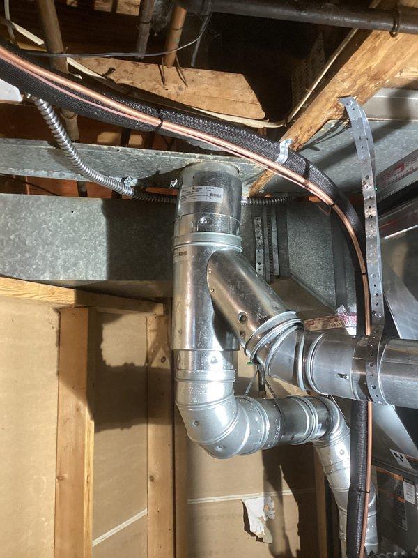 Successfully completed full HVAC system installation including a 70,000 BTU furnace and 2-ton air conditioning unit with rear discharge configuration. Installed complete venting system with aluminum vent piping, including multiple elbows and joints routed through attic space, secured all ductwork with proper metal strapping and brackets to wooden framing, and ran refrigerant lines with appropriate insulation. Connected all necessary electrical components using flexible metal conduit, integrated white PVC condensate drainage, and reconnected existing gas line to new furnace unit. Mechanical and electrical permits were obtained prior to installation, and all utility account information was collected for processing available rebates through DTE and SEMCO energy programs.