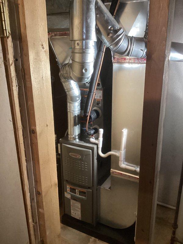 Successfully completed full HVAC system installation including a 70,000 BTU furnace and 2-ton air conditioning unit with rear discharge configuration. Installed complete venting system with aluminum vent piping, including multiple elbows and joints routed through attic space, secured all ductwork with proper metal strapping and brackets to wooden framing, and ran refrigerant lines with appropriate insulation. Connected all necessary electrical components using flexible metal conduit, integrated white PVC condensate drainage, and reconnected existing gas line to new furnace unit. Mechanical and electrical permits were obtained prior to installation, and all utility account information was collected for processing available rebates through DTE and SEMCO energy programs.