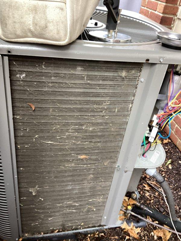 Completed annual cooling maintenance on residential air conditioning system. Performed comprehensive inspection of outdoor condensing unit, noting significant accumulation of dirt and debris on condenser coils requiring attention. Documented heavily soiled coil surfaces with substantial buildup affecting heat transfer efficiency. Inspected all electrical connections, wiring, and control components, confirming proper terminations and secure connections. Verified refrigerant line connections and service valves for integrity. System operational at time of inspection with no immediate failures detected. Customer declined spot cleaning service and opted to renew annual maintenance agreement for continued coverage.