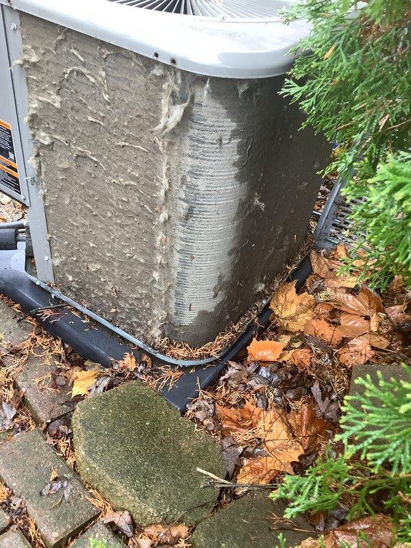 Completed annual cooling maintenance on outdoor HVAC unit, including filter and evaporative cooler pad replacement as scheduled. Unit exterior insulation shows significant weathering and deterioration that may require future attention, though system remains operational. Cleared surrounding debris and verified proper drainage line function.