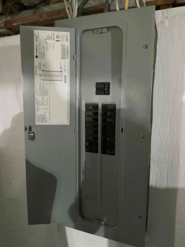 Conducted comprehensive site evaluation for new central air conditioning system installation at single-family residence currently equipped with boiler heating only. Assessed existing electrical service panel in basement utility area, confirming adequate circuit breaker capacity and panel condition for AC system integration. Evaluated basement mechanical space layout, noting available clearances around existing laundry appliances and ductwork routing options from current heating system. Documented electrical infrastructure, mechanical room dimensions, and potential equipment placement locations. Provided estimate for complete central AC installation including outdoor condensing unit, indoor air handler, refrigerant lines, electrical connections, and integration with existing duct system where applicable.