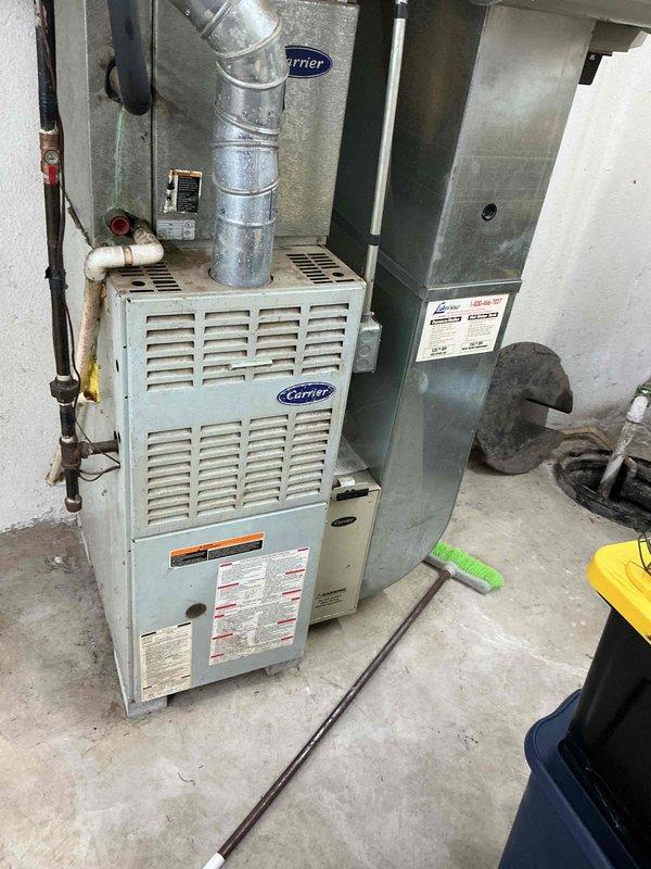 Conducted comprehensive evaluation of 16-year-old Carrier furnace and air conditioning system for full HVAC replacement estimate. Assessed existing equipment condition, documented current installation configuration including ductwork connections, refrigerant line routing, and electrical service panel capacity to determine optimal replacement system specifications for improved efficiency and performance.