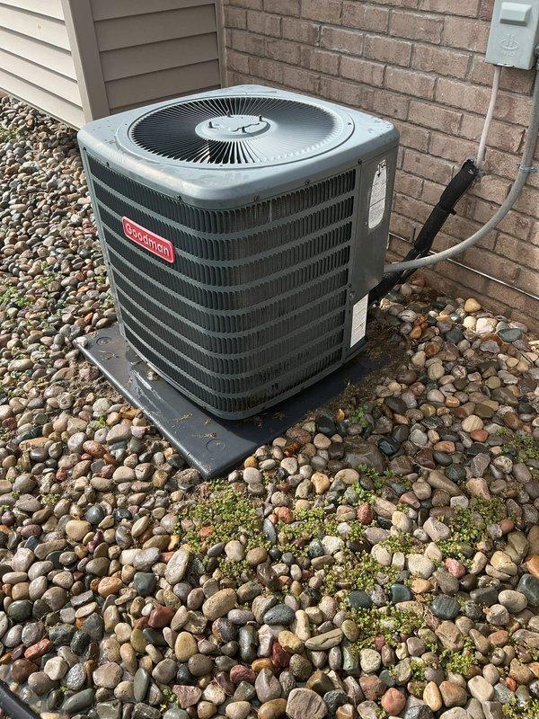 Completed annual cooling maintenance on Goodman residential condenser unit. Performed comprehensive system inspection, verified proper operation of compressor and condenser fan motor, checked electrical connections and disconnect box, and confirmed adequate refrigerant levels. Unit operating within normal parameters with no deficiencies noted at time of service.