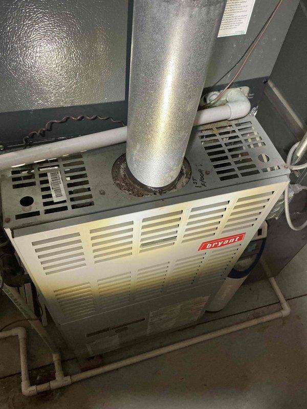 Provided estimate for complete HVAC system replacement including basement-installed natural gas furnace and exterior air conditioning condenser unit under BOGO promotion. Existing 23-year-old Bryant furnace remains operational while 15+ year-old AC unit is non-functional, requiring full replacement of both systems to restore complete heating and cooling capabilities.