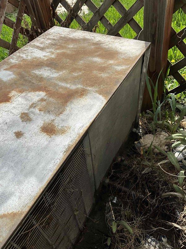 Completed comprehensive assessment of 45-year-old air conditioning system that ceased operation during previous cooling season. Unit exhibited severe age-related deterioration including extensive mold growth, rust staining on exterior panels, and compromised internal components with significant dust accumulation throughout the cabinet. Documented existing equipment condition through detailed photography of both indoor and outdoor components, capturing deteriorated wiring connections, weathered housing, and outdoor condenser unit showing advanced surface degradation. Provided replacement estimate to ensure new system installation prior to upcoming warm weather season.