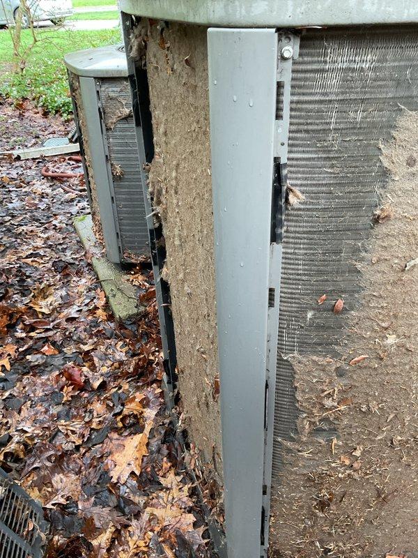 Performed annual coil maintenance on two outdoor HVAC condensing units. Both units exhibited heavy accumulation of dirt, leaves, and organic debris on heat exchanger coils and surrounding areas. Removed access panels to expose coil sections, thoroughly cleaned all finned coil surfaces to restore proper airflow and heat transfer efficiency, cleared debris from unit interiors and perimeters, and replaced air filters. Units restored to optimal operating condition.