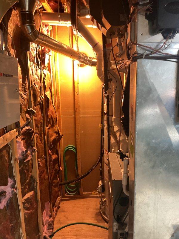 Completed full HVAC system installation including 4-ton air conditioning unit with evaporator coil and hot water heater replacement. Unit positioned at rear of property with electrical reconnection performed by licensed electrician. All copper refrigerant lines installed and brazed with proper insulation, gas piping connected to new water heater with code-compliant yellow-handle shutoff valve, and flue venting properly secured to existing ductwork. Mechanical and electrical permits obtained prior to installation. System tested and verified operational upon completion.