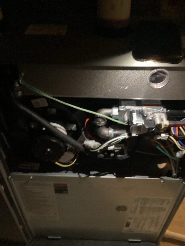 Completed annual heating maintenance on 10-year-old furnace as part of membership tune-up service. Performed comprehensive system inspection including visual examination of gas valve assembly, heat exchanger, burner compartment, and all internal mechanical components. Verified proper operation of blower motor, checked electrical connections throughout the unit, and inspected all wire harnesses for secure connections and signs of wear. Examined copper refrigerant lines, gas piping, and all fittings for proper installation and potential leaks. Tested ignition system components, confirmed flame sensor operation, and verified proper combustion. Inspected condensate drain system and verified clear drainage. Checked all safety controls including limit switches and pressure switches for proper function. Verified thermostat communication and system cycling. Replaced air filter and cleaned blower assembly. Tested system startup and shutdown sequences, confirmed proper heating operation througho