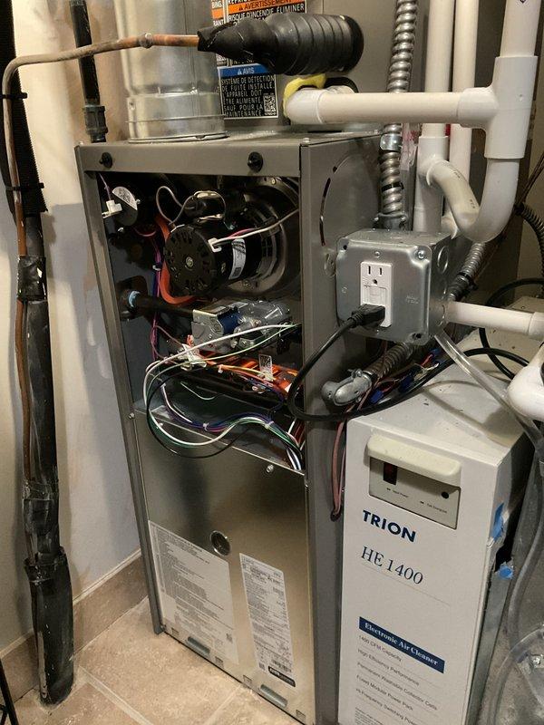 Completed annual heating maintenance and tune-up on residential furnace system as part of preventative maintenance membership. Performed comprehensive inspection of furnace components including blower motor assembly, electrical connections, control board with LED indicators, gas line connections, and associated HVAC equipment including Trion HE 1400 air filtration system. Verified all wiring connections, tested control sequences, and confirmed proper operation of all system components with no issues found.