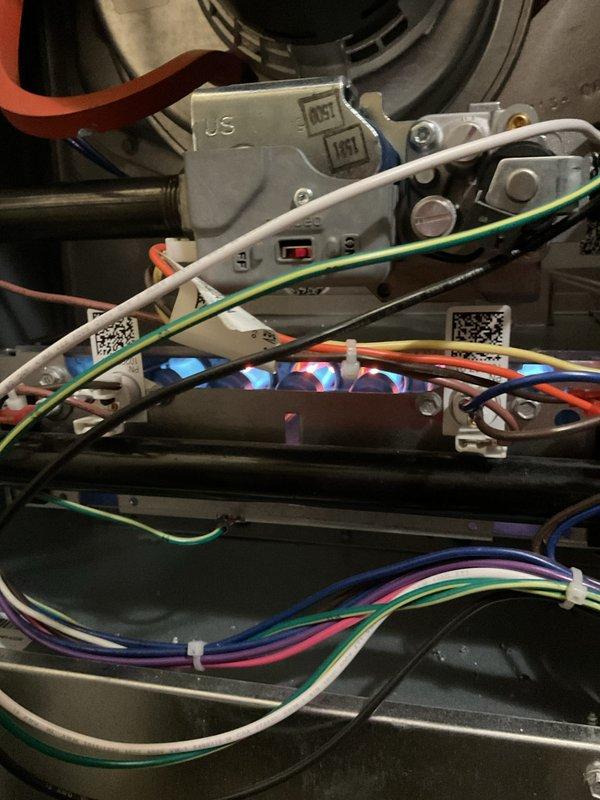 Completed annual heating maintenance and tune-up on residential furnace system as part of preventative maintenance membership. Performed comprehensive inspection of furnace components including blower motor assembly, electrical connections, control board with LED indicators, gas line connections, and associated HVAC equipment including Trion HE 1400 air filtration system. Verified all wiring connections, tested control sequences, and confirmed proper operation of all system components with no issues found.